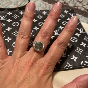 Dark grey stone ring with halo accent